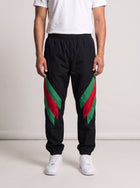 Gucci Tapered Striped Shell Trousers on model, front