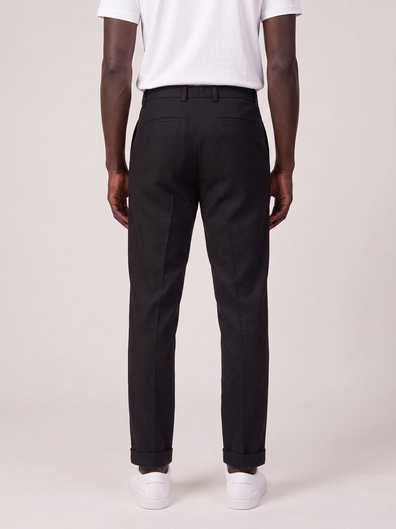 Slim fit comfort trousers on model, back