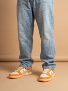 Dunk Low Safari Swoosh Kumquat aan de voet